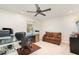 Well-lit office featuring a comfortable couch and a large desk at 283 Fields Se Ter, Port Charlotte, FL 33952