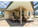 Outdoor patio with dining and lounging area, perfect for entertaining guests at 283 Fields Se Ter, Port Charlotte, FL 33952