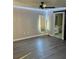 Bedroom with LED lights and wood-look flooring, conveniently located near the bathroom at 376 Waterside St, Port Charlotte, FL 33954