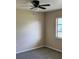 Neutral bedroom featuring a ceiling fan, carpet flooring, and a bright window at 376 Waterside St, Port Charlotte, FL 33954
