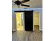 Bedroom featuring a sliding door leading to bathroom and closet at 376 Waterside St, Port Charlotte, FL 33954
