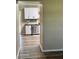 Kitchen featuring stainless steel dishwasher and white cabinets; ready for cooking and entertaining at 376 Waterside St, Port Charlotte, FL 33954
