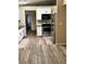 Spacious kitchen with stainless steel appliances, white cabinets, and wood-look flooring at 376 Waterside St, Port Charlotte, FL 33954