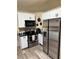 Updated kitchen features white cabinets, black countertops, and stainless steel appliances at 376 Waterside St, Port Charlotte, FL 33954