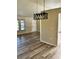Living room featuring contemporary lighting and wood-look flooring at 376 Waterside St, Port Charlotte, FL 33954