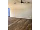Open living room with wood-look floors and neutral walls, ready for personalization at 376 Waterside St, Port Charlotte, FL 33954