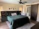 Main bedroom with modern barn door and ceiling fan is spacious and comfortable at 376 Waterside St, Port Charlotte, FL 33954