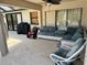 Relaxing covered patio with comfortable seating area, ideal for outdoor lounging at 376 Waterside St, Port Charlotte, FL 33954