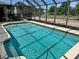 Private backyard pool with a screened-in lanai for outdoor enjoyment and relaxation at 376 Waterside St, Port Charlotte, FL 33954