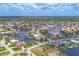 Vibrant aerial showcasing waterfront homes nestled among lush greenery, serene canals, and beautiful neighborhood scenery at 3866 Turtle Dove Blvd, Punta Gorda, FL 33950