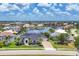 Breathtaking aerial view of waterfront property with lush landscaping, a long driveway, and beautiful neighborhood views at 3866 Turtle Dove Blvd, Punta Gorda, FL 33950
