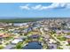 Expansive aerial view capturing waterfront homes surrounded by lush greenery and serene waterways in a coastal community at 3866 Turtle Dove Blvd, Punta Gorda, FL 33950