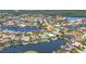 Scenic aerial view of waterfront homes with beautiful landscaping, private docks, and tranquil canals in a serene neighborhood at 3866 Turtle Dove Blvd, Punta Gorda, FL 33950