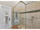 Bathroom with glass shower and tiled walls with an exterior view window at 3866 Turtle Dove Blvd, Punta Gorda, FL 33950