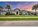 Stunning home with palm trees, lush landscaping, and a beautiful front lawn at 3866 Turtle Dove Blvd, Punta Gorda, FL 33950