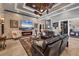 Cozy living room with a stone fireplace, comfortable sofas, and stylish decor at 3866 Turtle Dove Blvd, Punta Gorda, FL 33950