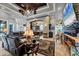 Open-concept living room with stone wall, modern fireplace, and views into the kitchen at 3866 Turtle Dove Blvd, Punta Gorda, FL 33950