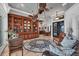 Cozy living room featuring a wooden bookcase, seating, and views to the water at 3866 Turtle Dove Blvd, Punta Gorda, FL 33950