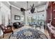 Inviting living room with waterfront views, a ceiling fan, and access to the patio at 3866 Turtle Dove Blvd, Punta Gorda, FL 33950
