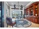 Charming living room with built-in shelving, waterfront views, and comfortable seating at 3866 Turtle Dove Blvd, Punta Gorda, FL 33950