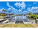 Scenic waterfront view with boat lifts, surrounded by lush greenery and calm waters at 3866 Turtle Dove Blvd, Punta Gorda, FL 33950