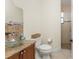 Stylish bathroom with a unique glass vessel sink and tiled walk-in shower at 4015 La Costa Island Ct, Punta Gorda, FL 33950