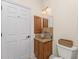 Well-lit bathroom featuring a stylish vanity with a glass bowl sink at 4015 La Costa Island Ct, Punta Gorda, FL 33950