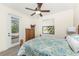 Comfortable bedroom with access to the pool, complemented by scenic pond views at 4015 La Costa Island Ct, Punta Gorda, FL 33950