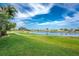 Scenic view of a golf course community with a pond and lush green grass and fairways at 4015 La Costa Island Ct, Punta Gorda, FL 33950