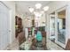 Dining area has a glass table, wicker chairs, and sliding glass doors leading to the outside at 4015 La Costa Island Ct, Punta Gorda, FL 33950