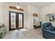 Elegant foyer featuring tile flooring, transom window, and a striking double-door entrance at 4015 La Costa Island Ct, Punta Gorda, FL 33950