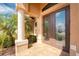 Inviting front porch with decorative tile flooring, and double doors with decorative glass inserts at 4015 La Costa Island Ct, Punta Gorda, FL 33950