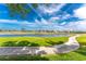Scenic view of a golf course and tranquil lake, enhancing the community's serene and inviting atmosphere at 4015 La Costa Island Ct, Punta Gorda, FL 33950