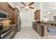 The kitchen features dark wood cabinets, stainless steel appliances, and granite countertops at 4015 La Costa Island Ct, Punta Gorda, FL 33950