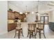 Bright kitchen features granite countertops, stainless steel appliances, and a breakfast bar with seating at 4015 La Costa Island Ct, Punta Gorda, FL 33950