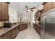 Bright kitchen with granite countertops, stainless steel appliances, and a breakfast bar with seating at 4015 La Costa Island Ct, Punta Gorda, FL 33950