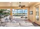This screened-in lanai offers seating and views of the outdoor pool, waterway, and community golf course at 4015 La Costa Island Ct, Punta Gorda, FL 33950