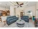 Spacious living room featuring modern decor, ceiling fan, recessed lights, and open access to the kitchen at 4015 La Costa Island Ct, Punta Gorda, FL 33950