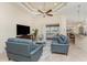 Bright living room with comfortable seating, stylish decor, and an open floor plan to the kitchen and outdoor space at 4015 La Costa Island Ct, Punta Gorda, FL 33950
