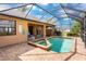 Screened-in lanai showcases a pool, spa, and patio, perfect for enjoying the outdoors and sunshine at 4015 La Costa Island Ct, Punta Gorda, FL 33950