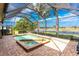 Screened lanai features a pool and spa, providing a private and relaxing outdoor space with a water view at 4015 La Costa Island Ct, Punta Gorda, FL 33950