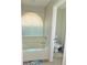 Bright bathroom features a soaking tub with blinds and a neutral color scheme at 4309 Badali Rd, North Port, FL 34286