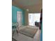 Bright breakfast nook with tiled floors, sliding glass doors to the lanai, and an adjacent kitchen at 4309 Badali Rd, North Port, FL 34286