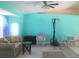 Bright living area featuring tiled floors, a ceiling fan, seating area and a separate area for a workout station at 4309 Badali Rd, North Port, FL 34286