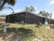 Backyard pool area with full screen enclosure at 4309 Badali Rd, North Port, FL 34286