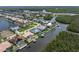 Gorgeous waterfront home with boat dock, pool, and lush tropical landscaping on the canal at 5720 Almar Dr, Punta Gorda, FL 33950