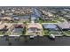 A high definition aerial view that shows the backyard pool, landscaping and boat dock at 5720 Almar Dr, Punta Gorda, FL 33950