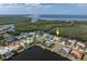 Stunning aerial view of canal-front home with boat dock, lush surroundings, and easy ocean access at 5720 Almar Dr, Punta Gorda, FL 33950