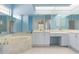 Bathroom features tub, marble countertop, double sinks, vanity area, and separate toilet and shower at 5720 Almar Dr, Punta Gorda, FL 33950