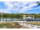 A waterfront boat lift amidst lush greenery, offering serene water views at 5720 Almar Dr, Punta Gorda, FL 33950